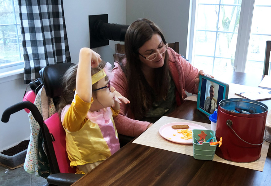 An FCDGC patient and their guardian meets with a researcher via video call